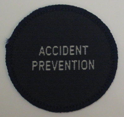 Circular cloth badge: Accident Prevention
