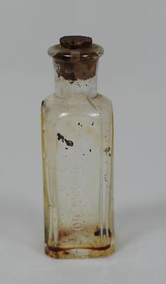 Small glass bottle, once contained Clock Oil