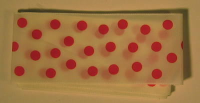 Length of hair ribbon, white decorated with red spots