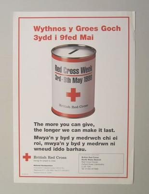 Small poster with an image of a collecting tin: 'The more you can give, the longer we can make it last. For more information, please contact British Red Cross North Wales Branch.'