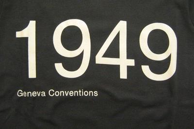 black t-shirt, with the words '1949 Geneva conventions'