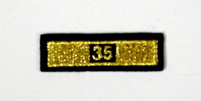 Service award consisting of a gold stripe with '35' incorporated in the design: 35 Years Service.