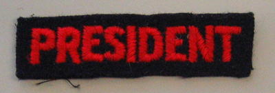 'President' x 3 (cloth, red on blue), 'President' (cloth, red on white)