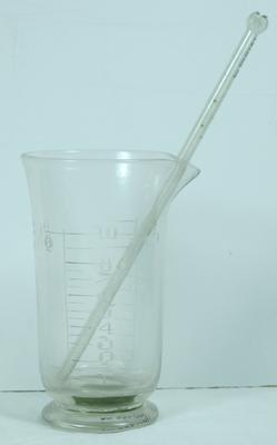 Glass measuring cup with stirring rod