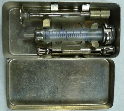 Syringe in a tin