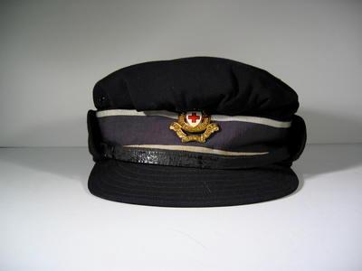 British Red Cross navy blue cap with gilt hat badge, name Bayley written in ink in lining.