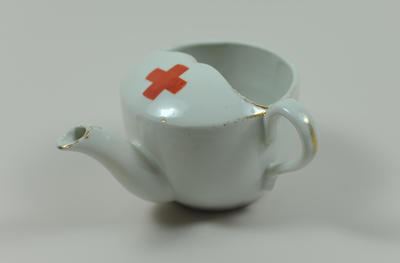Feeding cup, small, with gold rim, emblem.