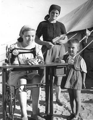 Two Yugoslav women and a child in a refugee camp; JWO/9/3/2a