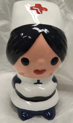 Modern pottery money box in the form of a nurse