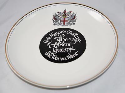 Commemorative plate inscribed 'Lord Mayor's Challenge. The Absent Guest. The War on Want'.
