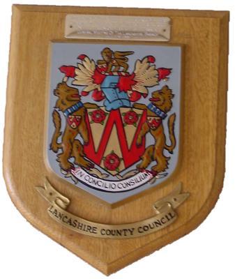 Brass and wooden shield presented to Countess Limerick, 1991