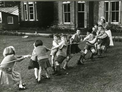 Children playing in the garden of a British Red Cross residential home