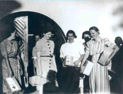 A group of women with Red Cross parcels at Liebenau civilian internment camp