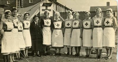Group of VADs including Geraldine Clay wearing Indoor Uniform outside a Recruitment Tent at a School Fete in Coulsdon