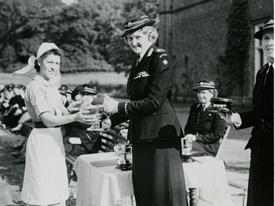 Duchess of Northumberland, President of Surrey Branch, presenting a Trophy to a Reigate Division Member