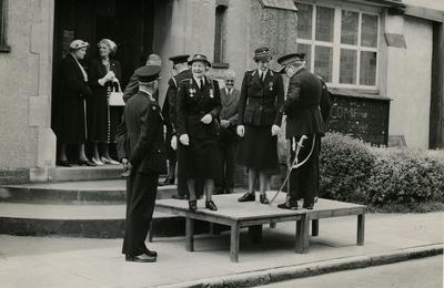 Group of Officers and Officials from the Farnham Division, Surrey, standing on a Dais outside a Church