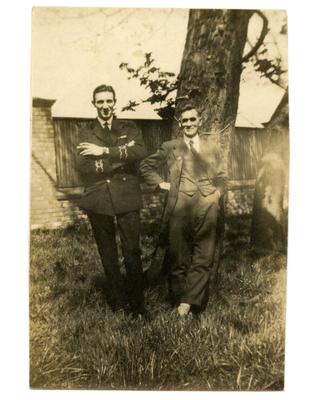 Two male [patients], one in [naval] uniform in the grounds of [Southmead Hospital, Bristol]