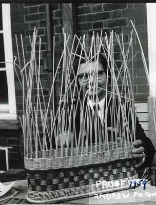 Black and white photograph of basket weaving activity at Barnett Hill