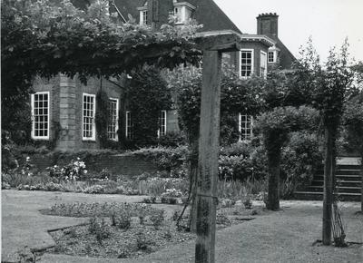Black and white photograph of the gardens and exterior of Barnett Hill