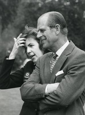 Black and white photograph of the Duke of Edinburgh with a member of the British Red Cross