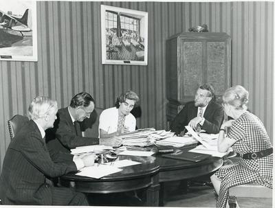 Black and white photograph of NHQ delegation discussing plans to attend the League Board of Govenors meeting in Mexico