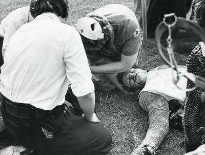 Black and white photograph of First Aid in Action