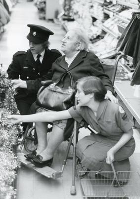 Black and white photograph of Youth and Juniors helping with Christmas shopping