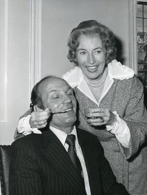 Black and white photograph of Dame Vera Lynn and Henry Cooper promoting Nursing for the Family