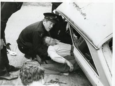 Black and white photograph from Red Cross News of disaster training following a car accident