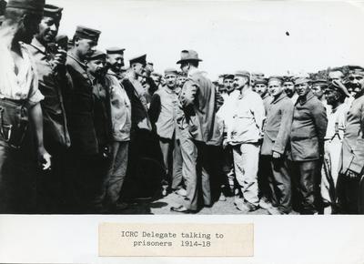 Black and white photograph of an ICRC delegate visiting prisoners of war during the First World War