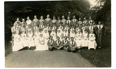 Hospital staff, V.A.D.s and patients on the grounds of Leeswood Hall VAD hospital.