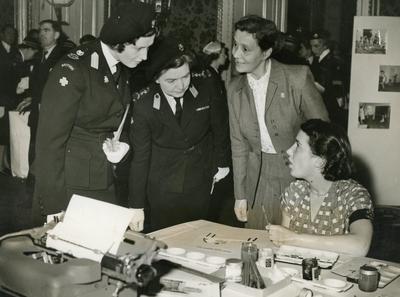 Photograph of a Young Girl demonstrating her work to Princess Alexandra