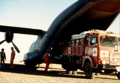Photograph of Stores being Unloaded from a Plane to a Truck