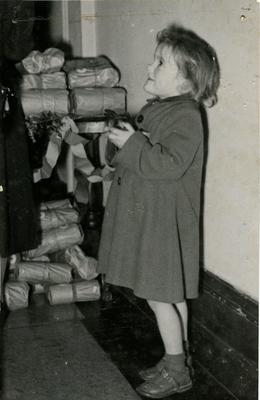 Child receiving a Food Parcel; RCB/2/58/3/3