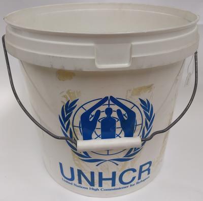 White plastic bucket donated by the United Nations High Commissioner for Refugees (UNHCR)