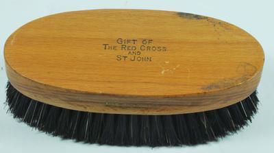 Clothes Brush stamped 'Gift of the Red Cross & St John'