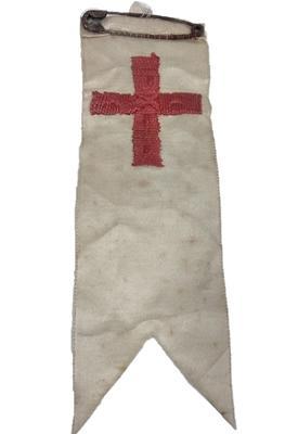 Embroidered red cross on silk