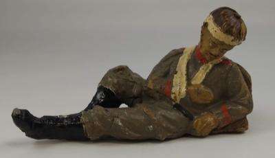 Small model of wounded and bandaged soldier