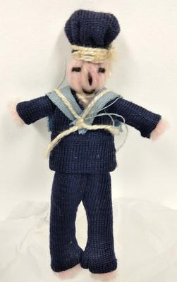 Small woollen doll dressed as a sailor