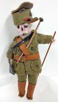 Small woollen doll dressed in British military uniform