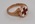 Gold ring featuring Red Cross emblem