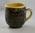 Ceramic slip-decorated mug with inscription 'British Red Cross Society Somerset'