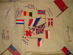 tablecloth emboidered with flags and signatures