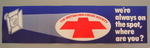 Small banner/poster: 'The British Red Cross Society. We're always on the spot, where are you?'