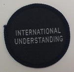Circular cloth badge: International Understanding