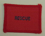 Plain red cloth badge for Youth uniform 'Rescue'.