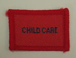 Plain red cloth badge for Youth uniform 'Child Care'.
