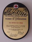Wood and brass plaque fromThe Philippine National Red Cross to The British Red Cross for its support following an earthquake in 1990