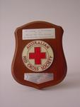 Small wooden shield presented in friendship to the British Red Cross by the Australian Red Cross Society, Tasmanian Division