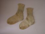 pair of cream coloured woollen socks
